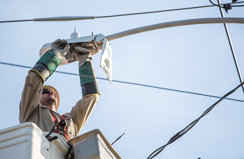 Man working on streetlight